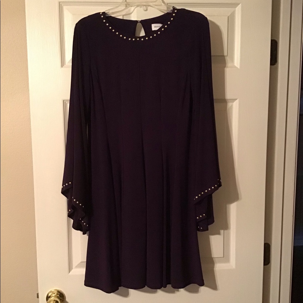 Eggplant Colored Dress with Gold Rivets around the neck and sleeves.